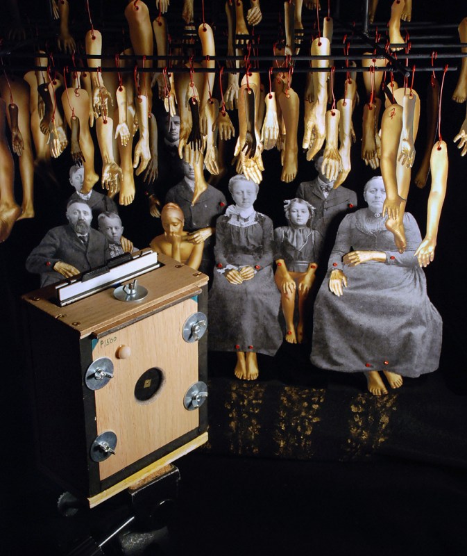 4x5 Camera with "Hands of Gold, Heart of Stone" diorama in the background